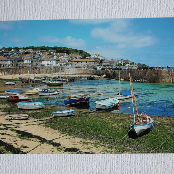 Photographic greetings card of Mousehole harbour at low tide.