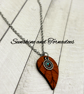 Handmade leaf pendant necklace with a nature-inspired woodland design.