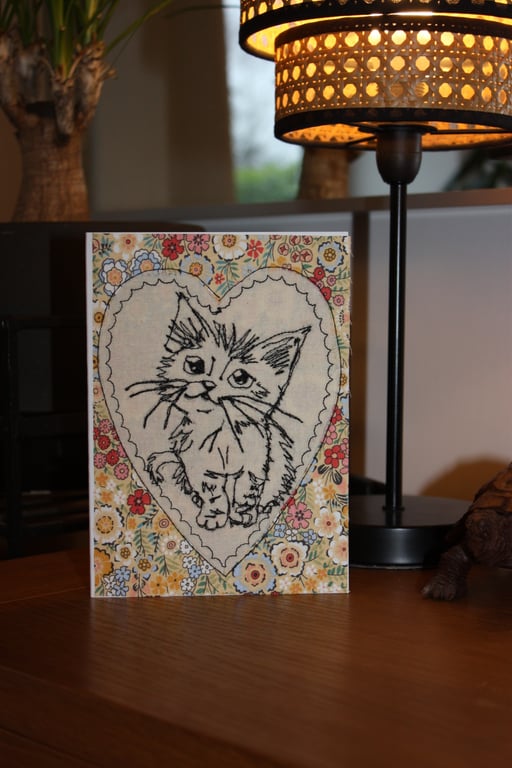 Cute kitten in a heart