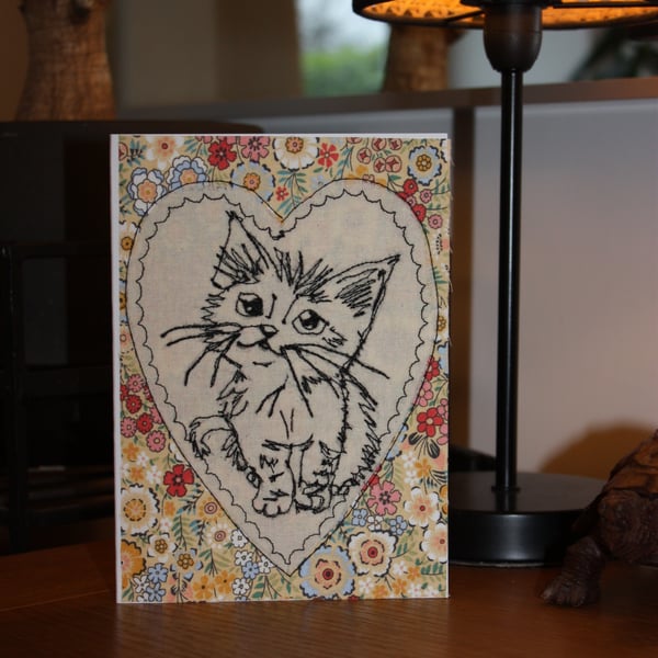 Cute kitten in a heart