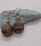 Earrings in a chestnut brown swirl design