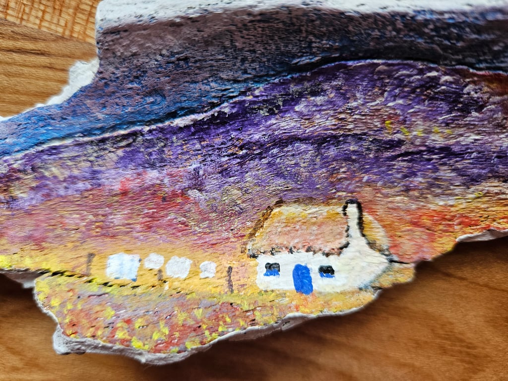 Original painting on driftwood of Scottish croft. 