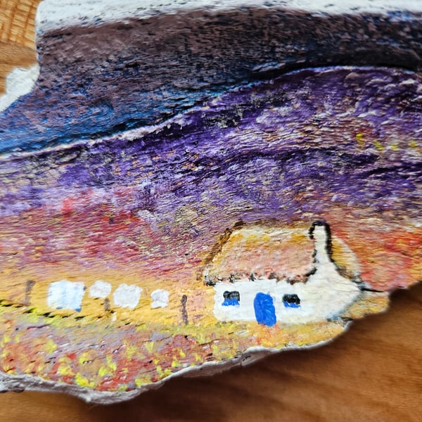 Original painting on driftwood of Scottish croft. 