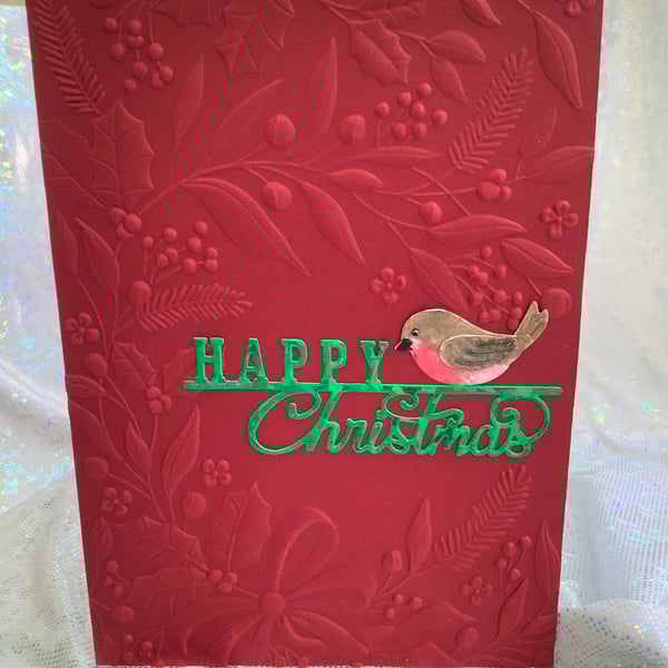 Christmas in a vibrant red with Little Red Robin sending you greetings.