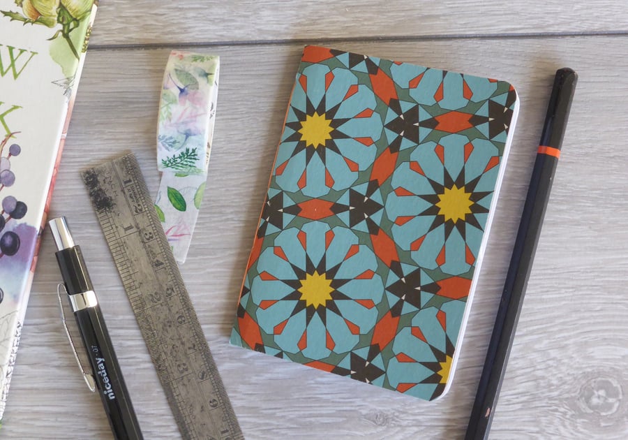 Small hand bound A7 notebook or sketchbook with blue and orange patterned cover