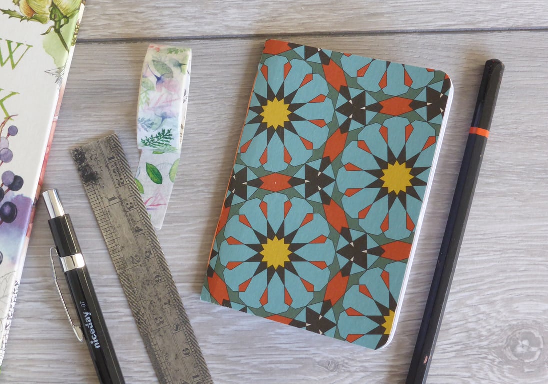 Small hand bound A7 notebook or sketchbook with blue and orange patterned cover