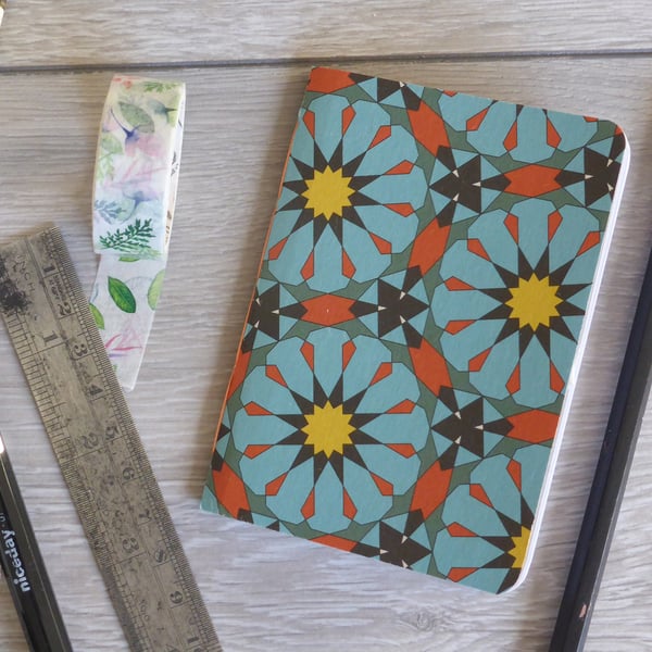 Small hand bound A7 notebook or sketchbook with blue and orange patterned cover
