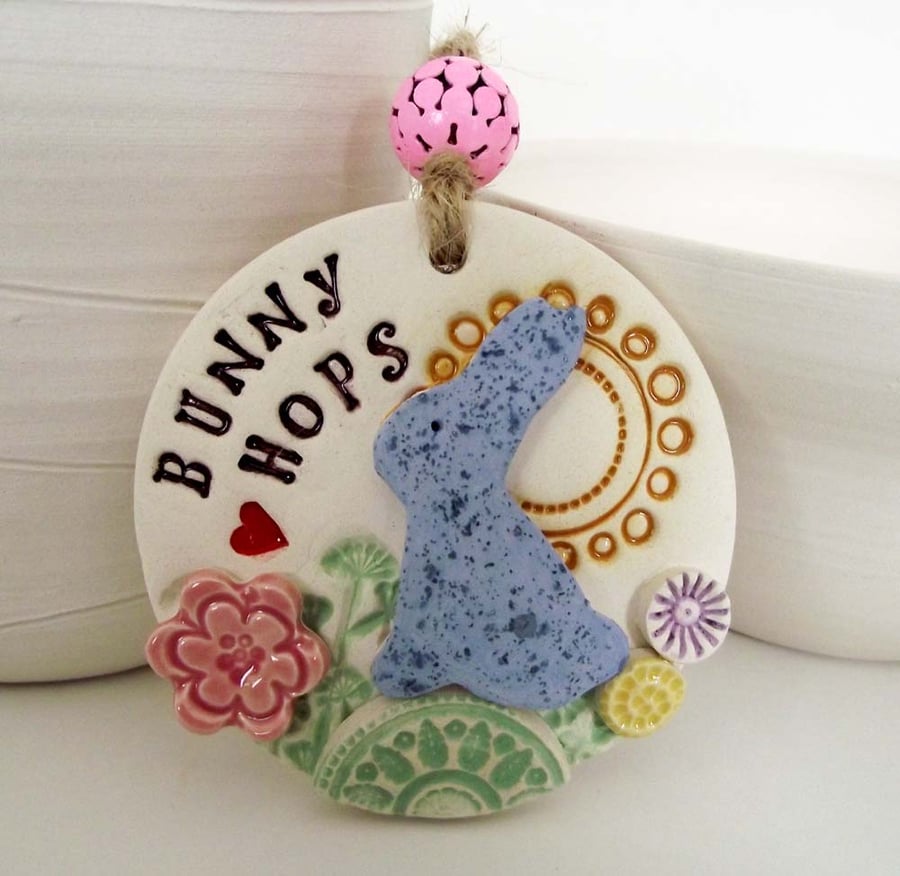 Ceramic decoration with rabbit and flowers