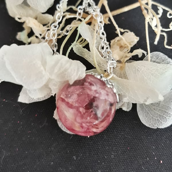 R 9. Clear resin globe necklace with dried delphinium flower