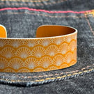 Geometric shell pattern cuff bracelet yellow orange