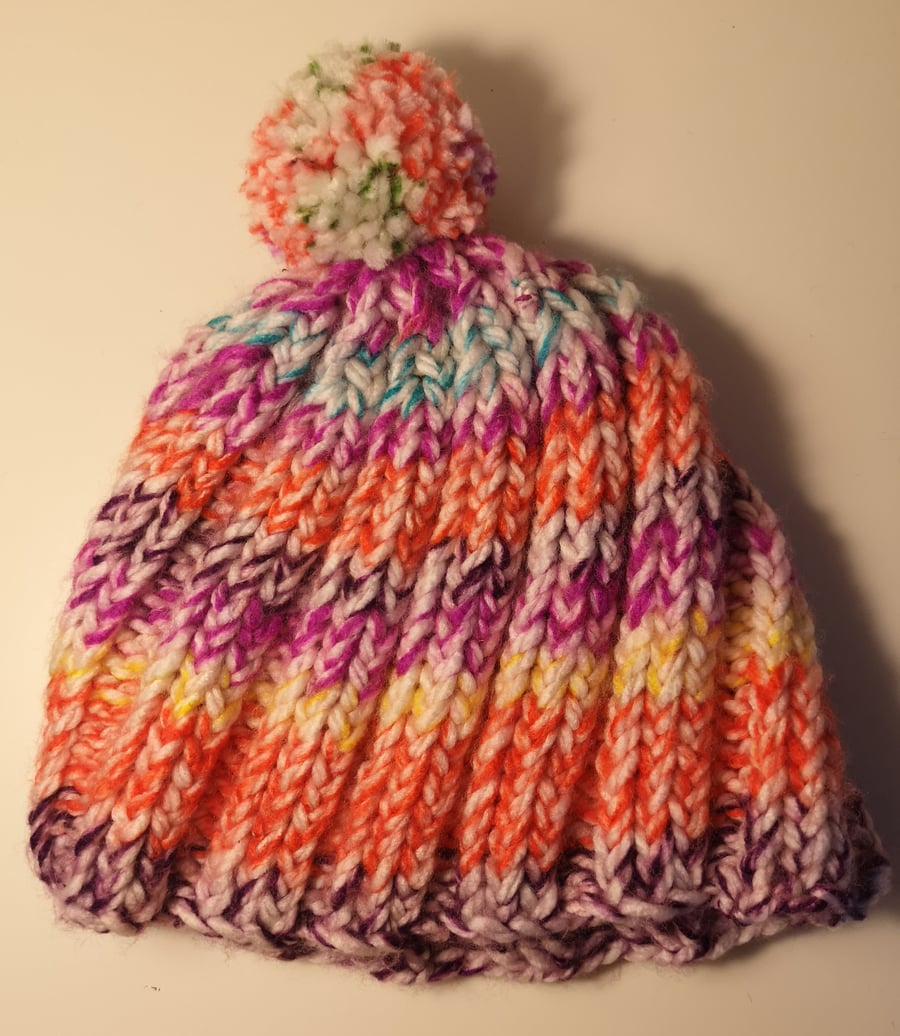 Handknitted white and bright colour twisted yarnbobble hat