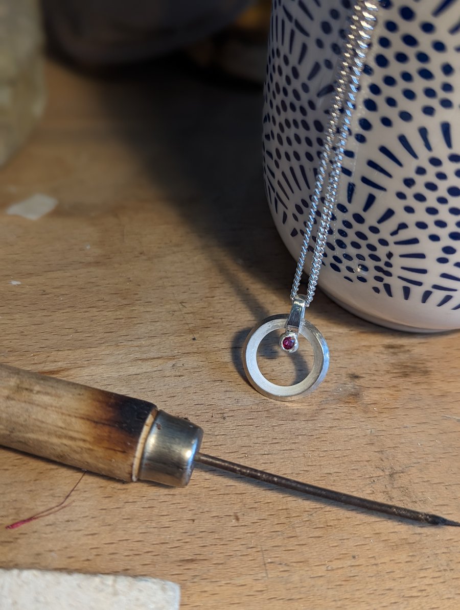 Circular Silver Pendant with Ruby