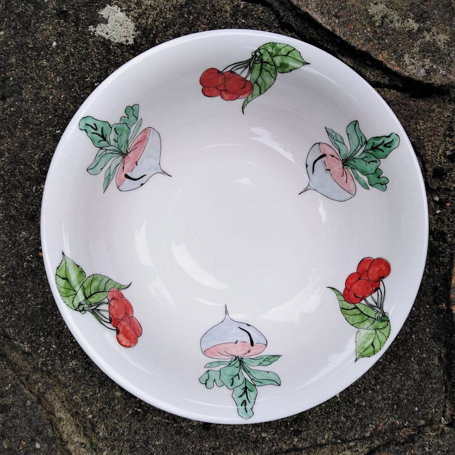 Fruit or dessert bowl decorated with an unusual mixture of cherries and turnips
