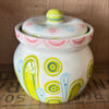 Small lidded ceramic pot with pink flower decoration