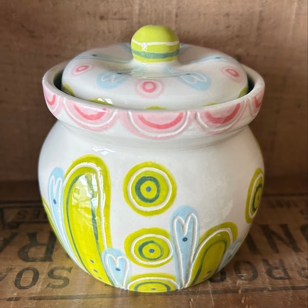 Small lidded ceramic pot with pink flower decoration