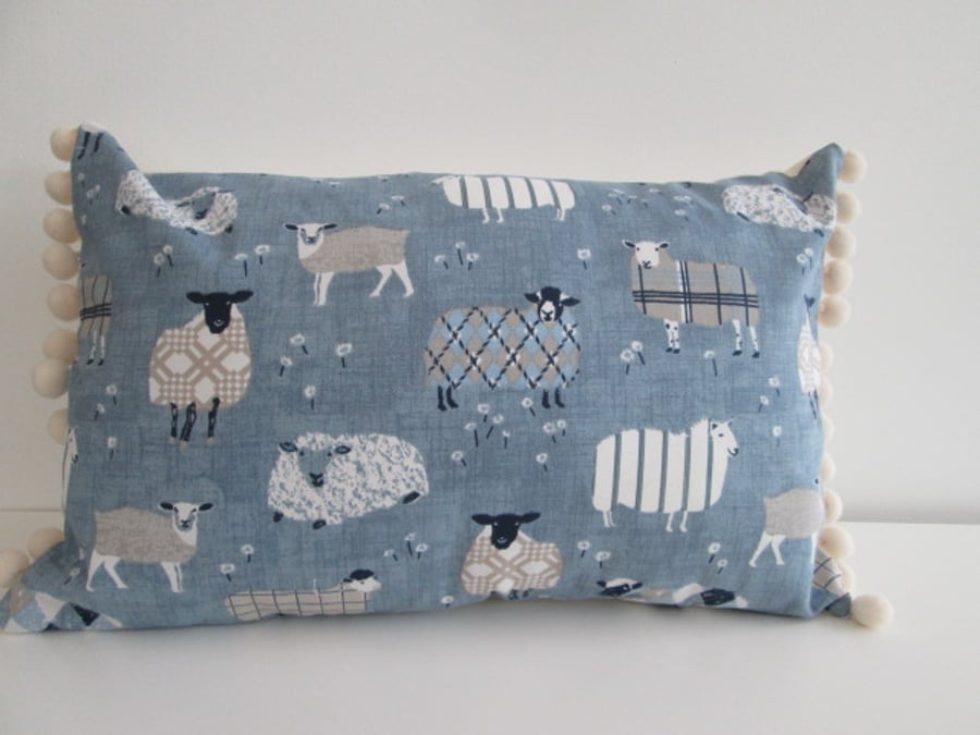 Blue  Sheep Cushion with cream Pom Poms