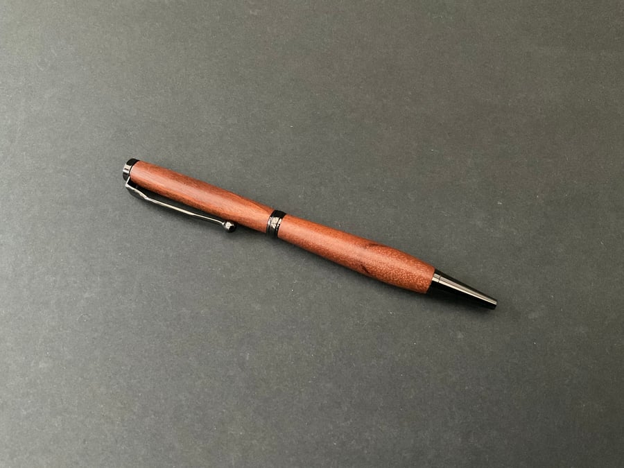 Slimline twist ballpoint pen made with pink ivory hardwood - black ink