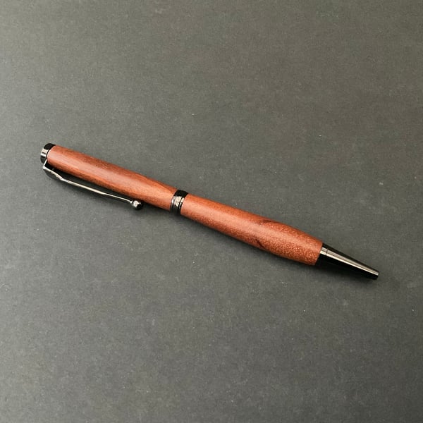 Slimline twist ballpoint pen made with pink ivory hardwood - black ink