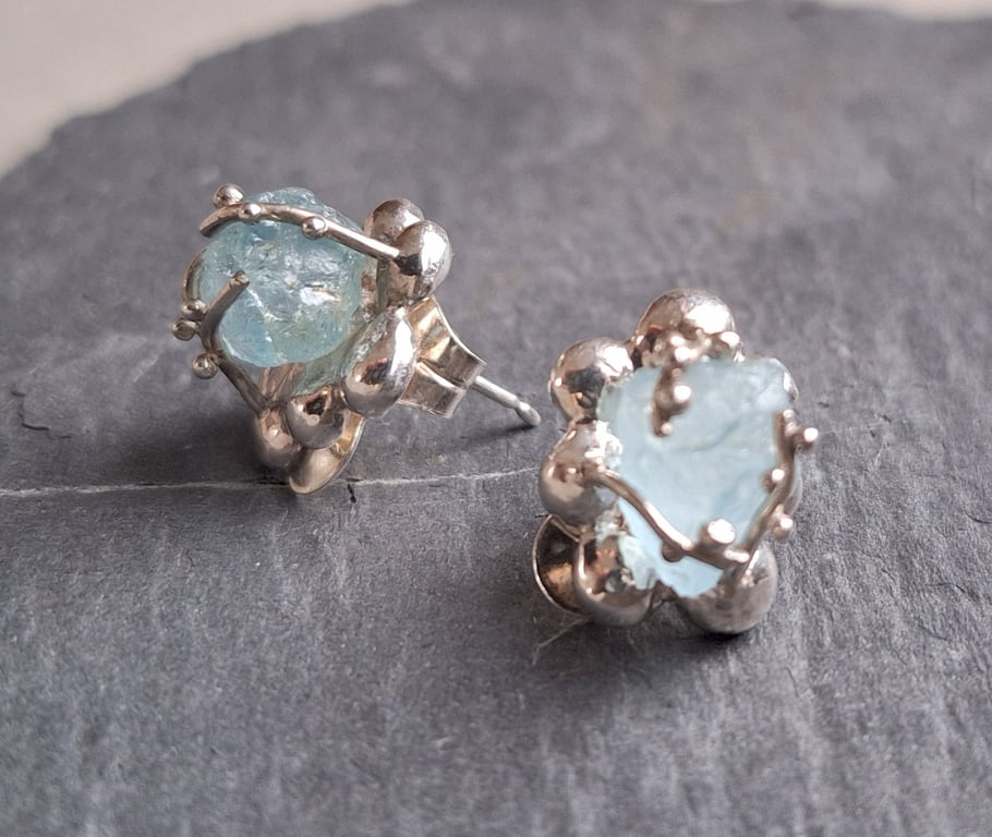 Silver earrings with natural freeform aquamarine.