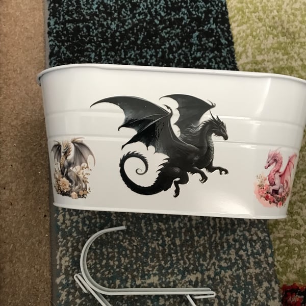 White fence planter with dragon motif 
