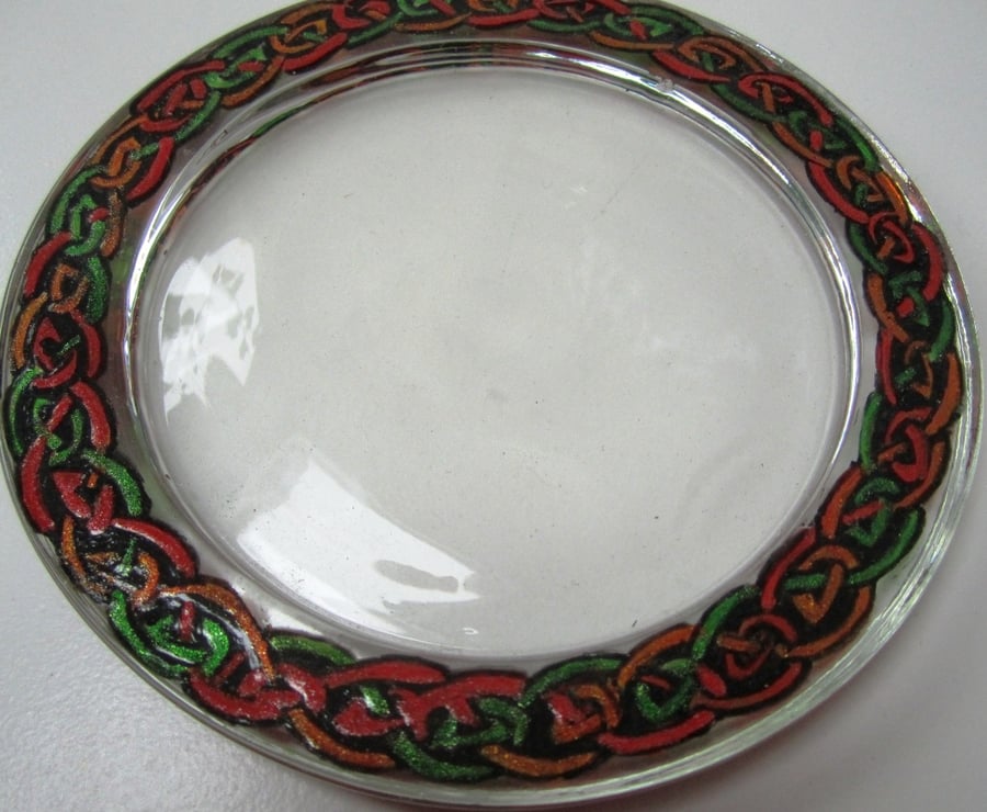 Glass Coaster with hand painted Celtic knot border in green, red and orange