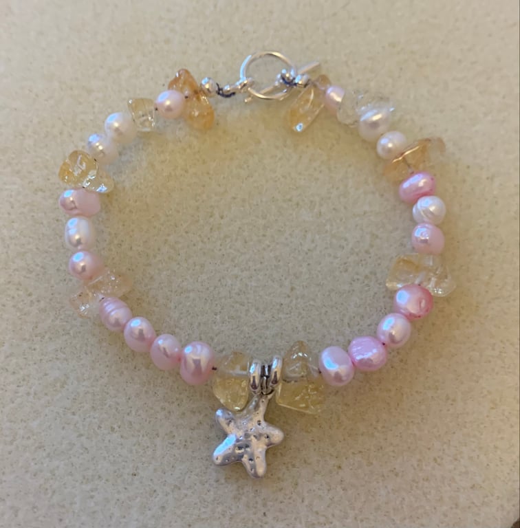 Beautiful citrine and freshwater pearl bracelet with silver toggle fastener..