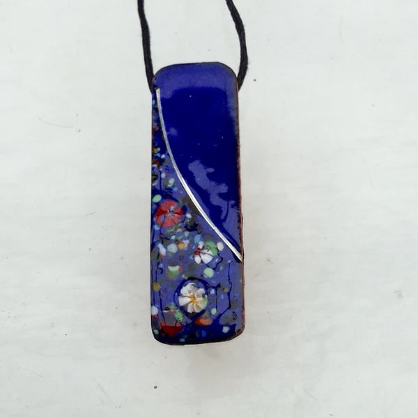 SMALL, SLIM, OBLONG FLORAL ENAMELLED PENDANT WITH STERLING SILVER DESIGN