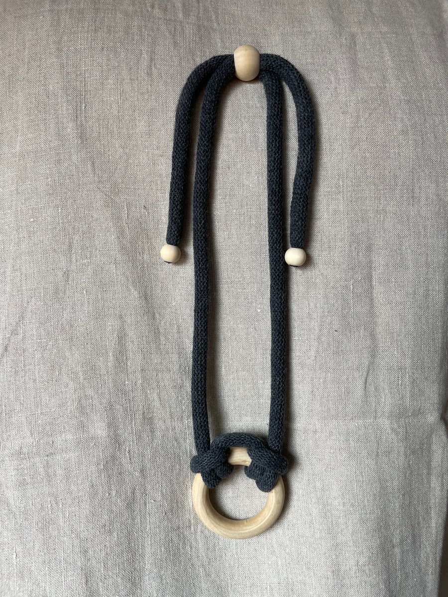 Knotted rope necklace with single small wooden ring