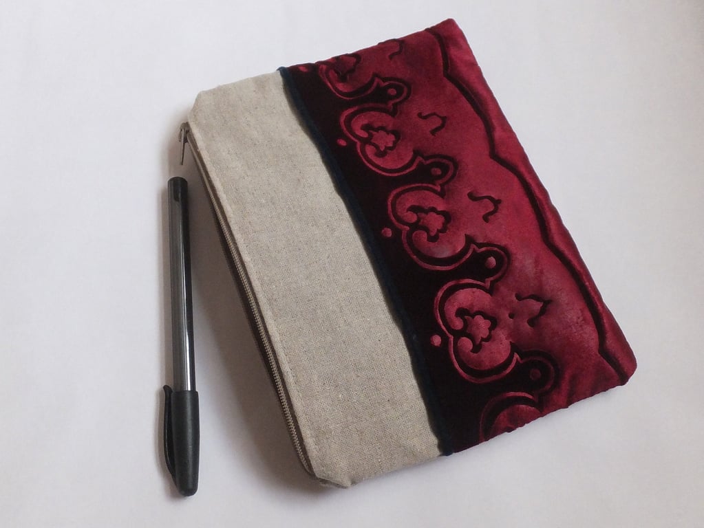 Burgundy zip pouch bag with embossed velvet border and linen design medium size.