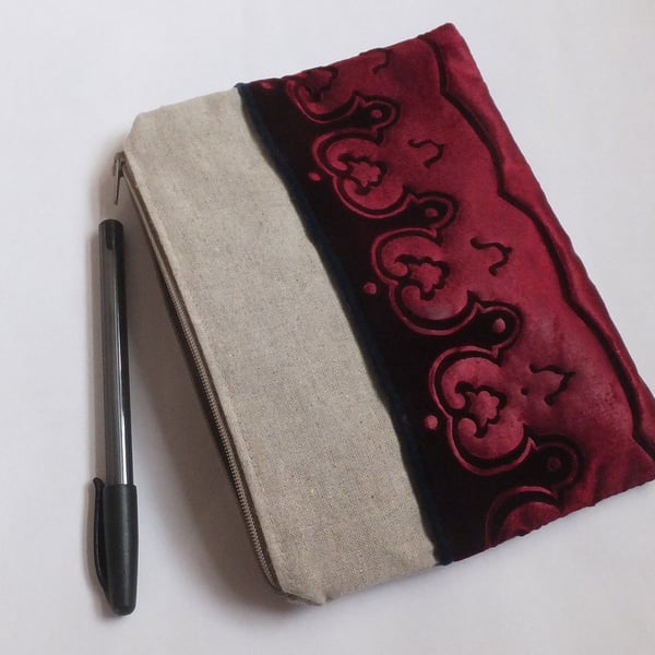 Burgundy zip pouch bag with embossed velvet border and linen design medium size.