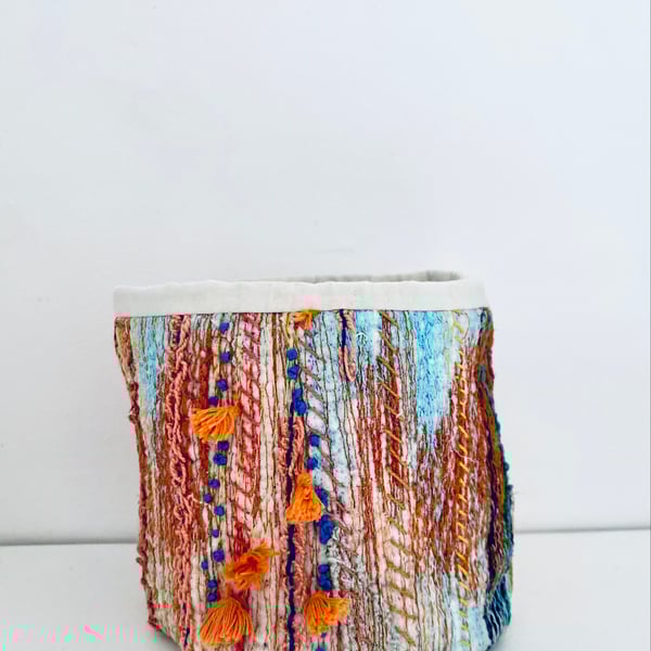 Colourful storage container or pot plant holder