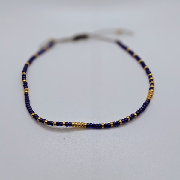 Dark blue gold thin glass bead adjustable bracelet