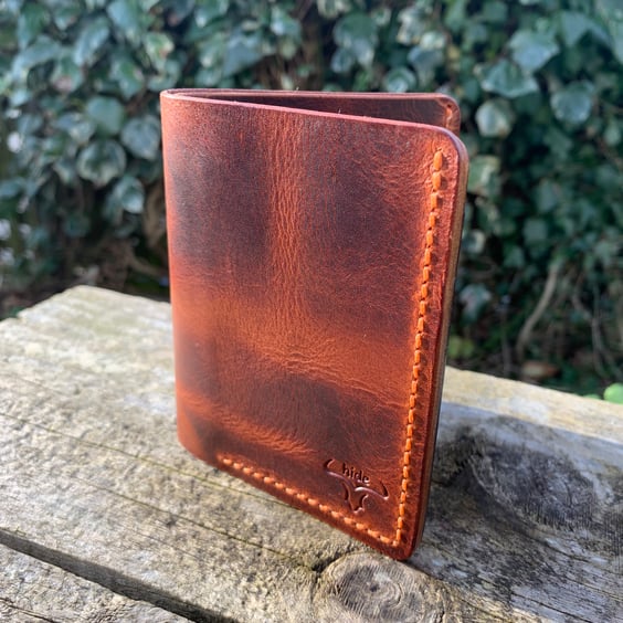 Leather wallet bifold in brown with 4 card slots and a cash section