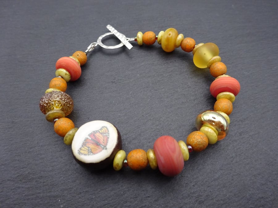 lampwork glass orange bracelet, butterfly jewellery