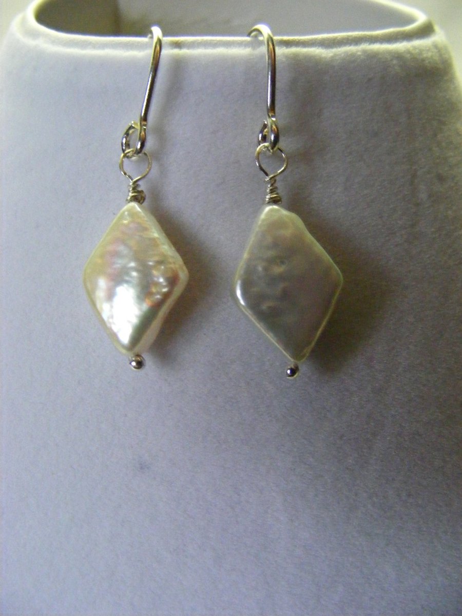 White Freshwater Cultured Diamond Pearl Earrings.