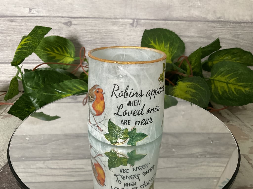 Decoupaged tea light holder. Robins appear.