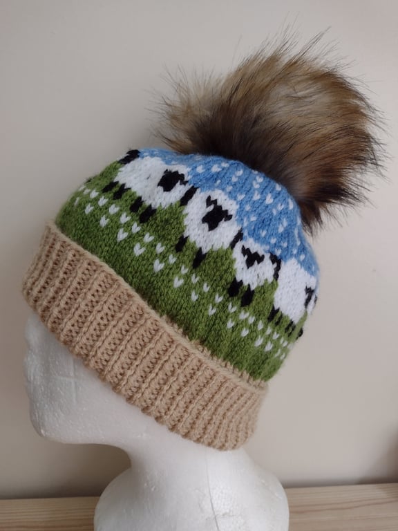 A circle of sheep ( and other creatures) pom-pom hat