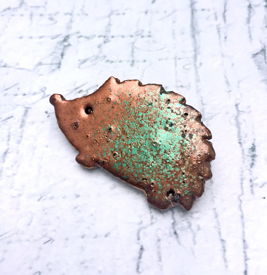 Wooden Hedgehog brooch in copper and jade embossing enamel British wildlife