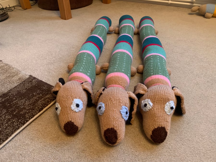 Hand knitted sausage dog draught excluder 