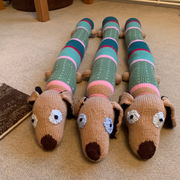 Hand knitted sausage dog draught excluder 