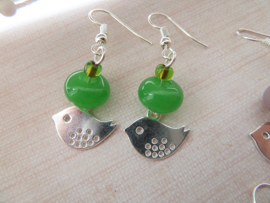 green bird charm earrings