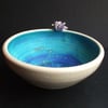 Small ceramic hand thrown crackle bowl with sea glaze interior and purple bird