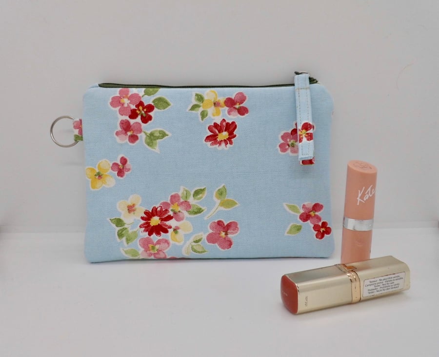 SOLD Zipped purse make up bag in blue floral fabric.