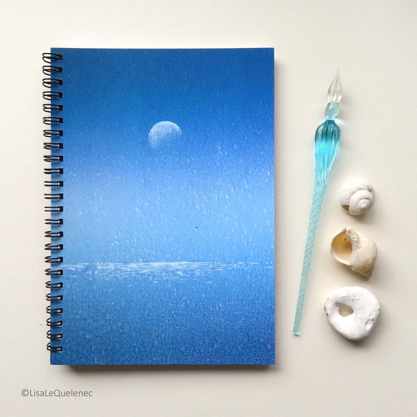 Spiral bound A5 (6x8) notebook with a moon sparkling over the ocean on the cover