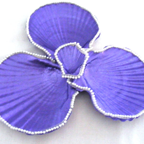 Metallic purple scallop shell trinket dish with pearl trim.