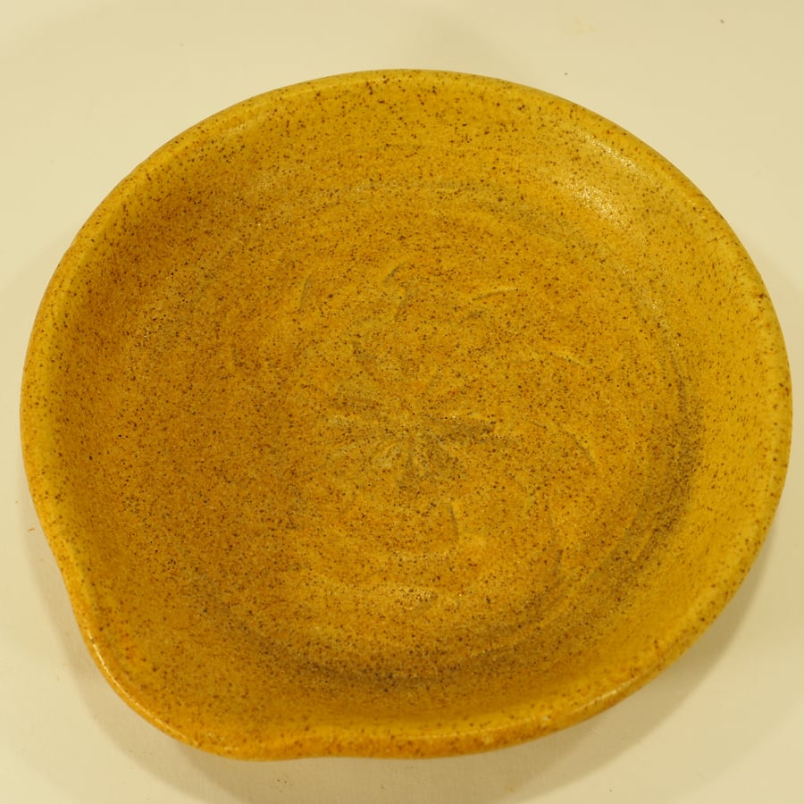 Speckled yellow Handmade ceramic spoon-rest with spiral flower design