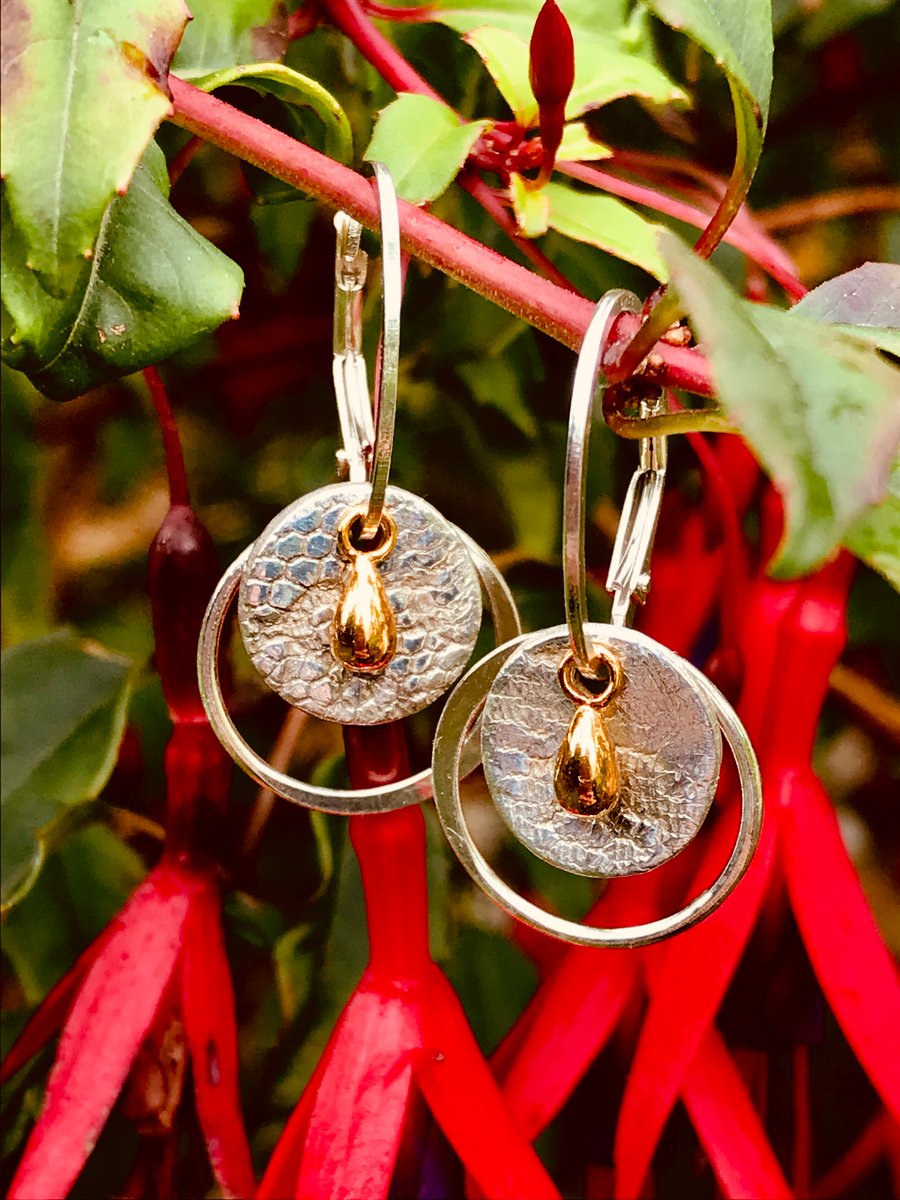 Silver disc earrings with a mini gold droplet