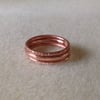 Solid copper textured triple stacking rings.