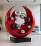 Orbital Echoes Handcrafted Modern Circular Sculpture with High Gloss Finish.