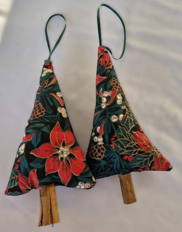 Pair of hand crafted fabric christmas tree decorations with cinnamon trunk